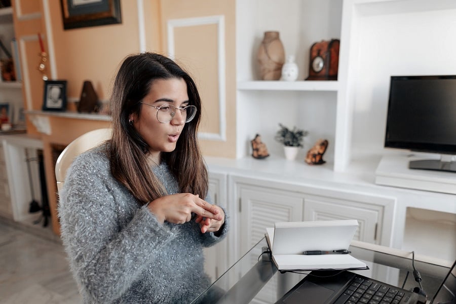 Young Woman Using Sign Language on Video Call - Digital Accessibility